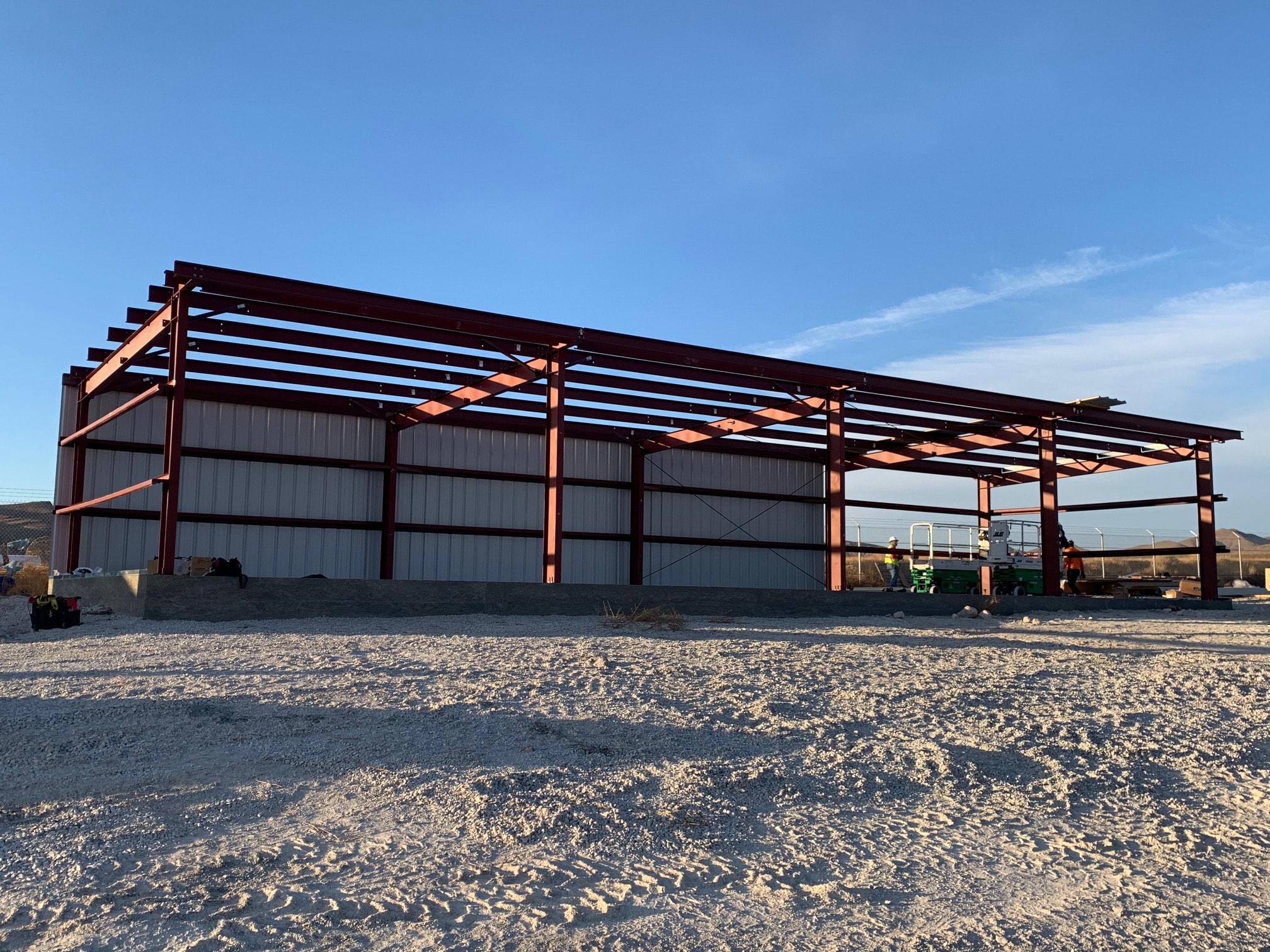 Metal building steel frame under construction in Western Arizona desert